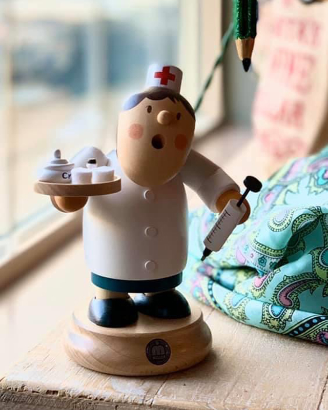 Wooden doctor figurine